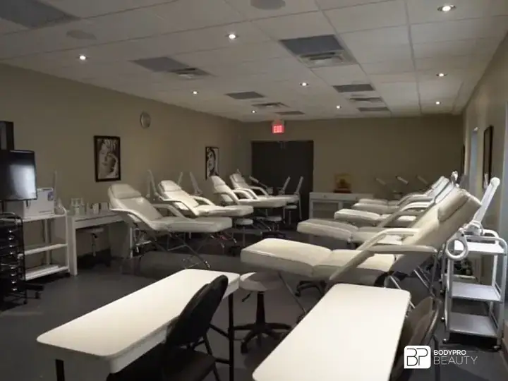 Body Pro Beauty classroom with treatment beds and training stations at the Brampton campus.